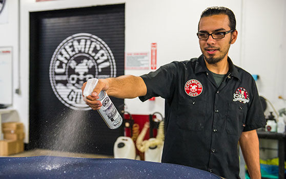 Spraying Convertible Top Cleaner on Convertible Top