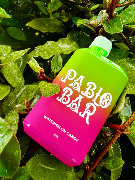 Vape Pablo Bar on grass in drops