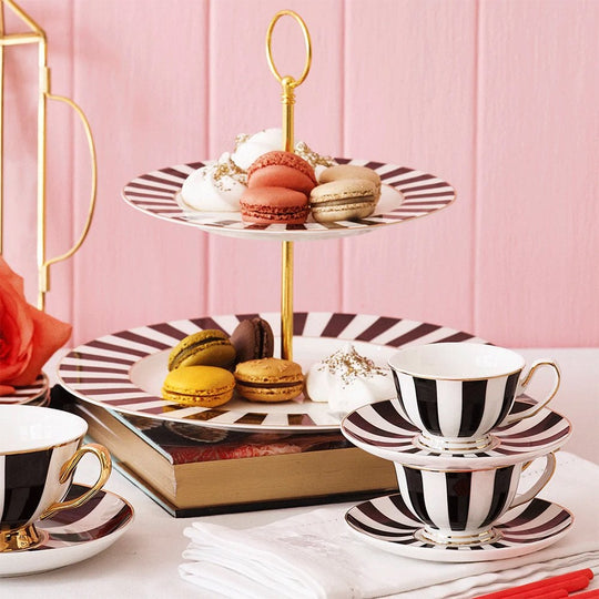 https://cdn.shopify.com/s/files/1/0742/9672/1715/products/black-and-gold-striped-fine-china-2-tier-cake-stand-p4733-18647_image_540x.jpg?v=1682600104