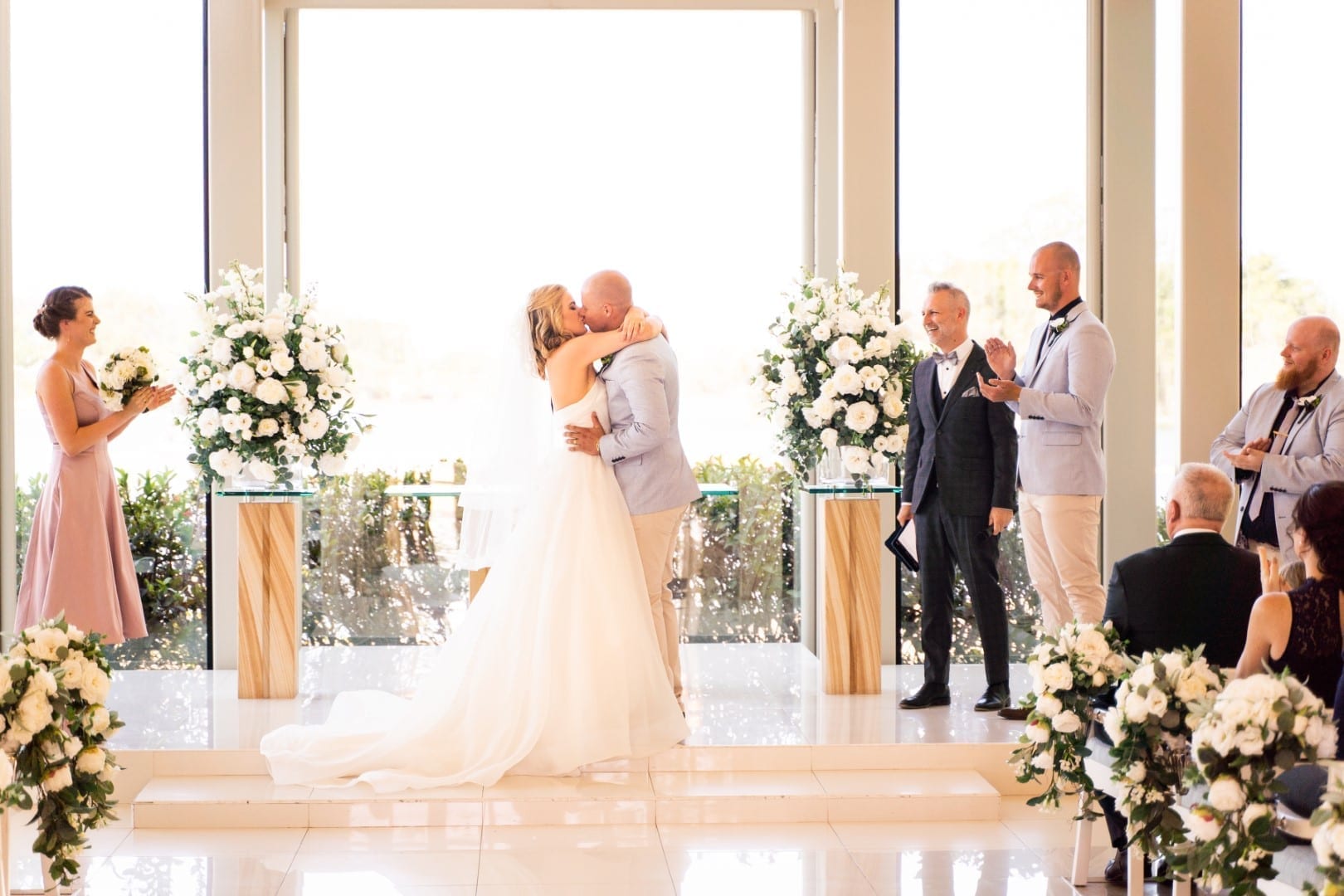 Khan kissing his bride.