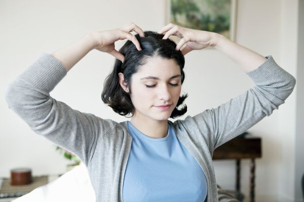 Woman Giving Herself Scalp Massage | ISA Professional