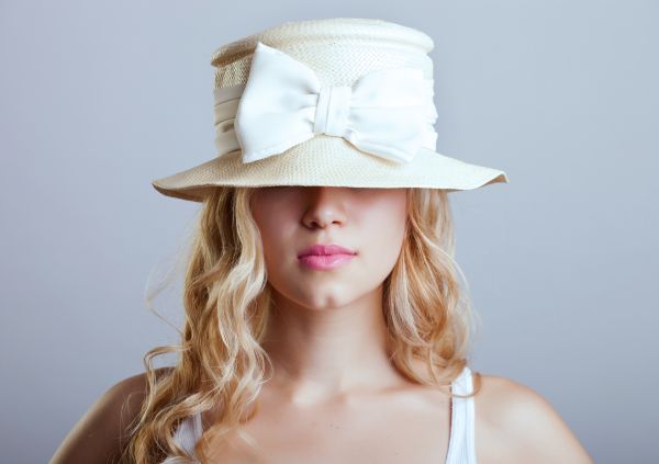 Woman Hiding Behind White Hat | ISA Professional