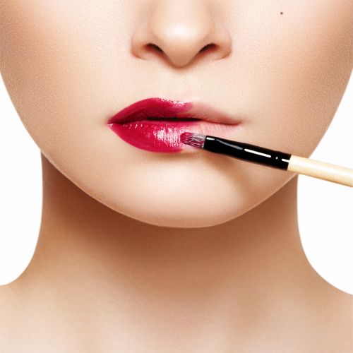 Woman Applying Red Lipstick | ISA Professional