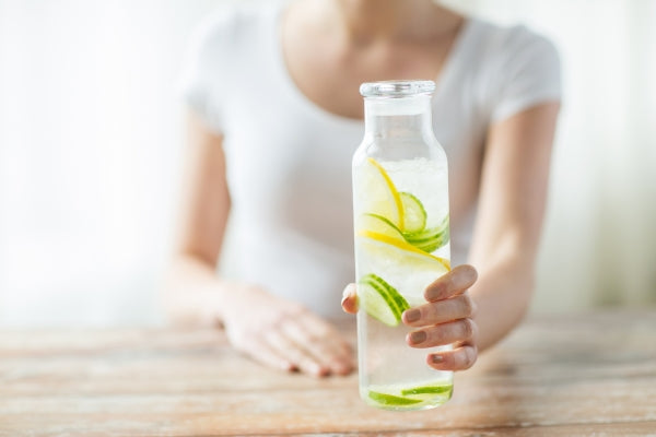 Woman Drinking Lemon Water- ISA Professional