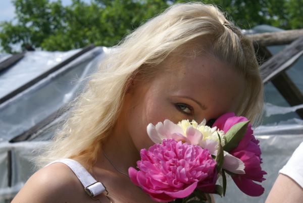 Woman Hiding Face Behind Flowers ISA Professional