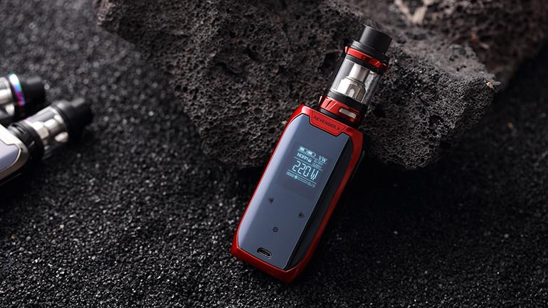 Vape mods laid in black sand