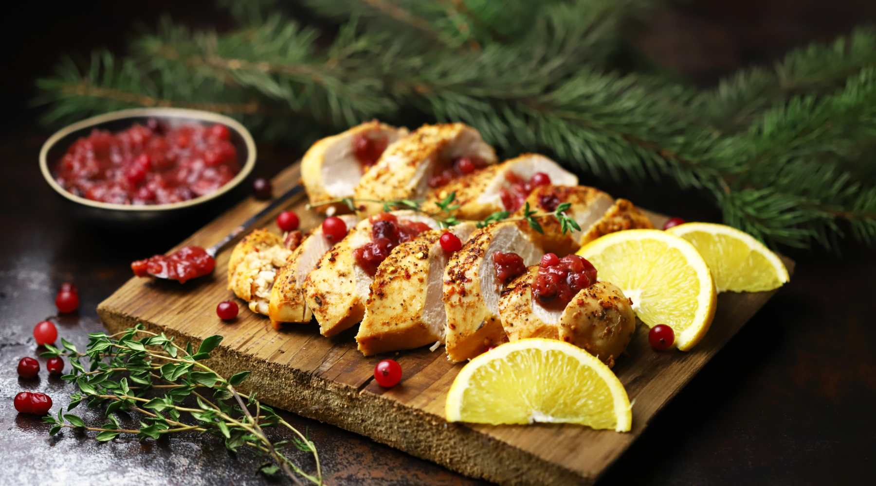 Lemons in whole cranberry sauce with sliced turkey roast