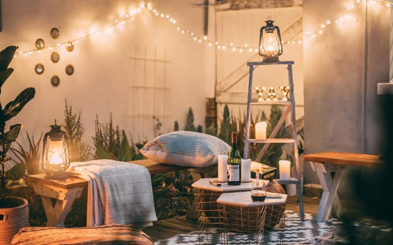 outdoor hygge - cozy patio with string lights