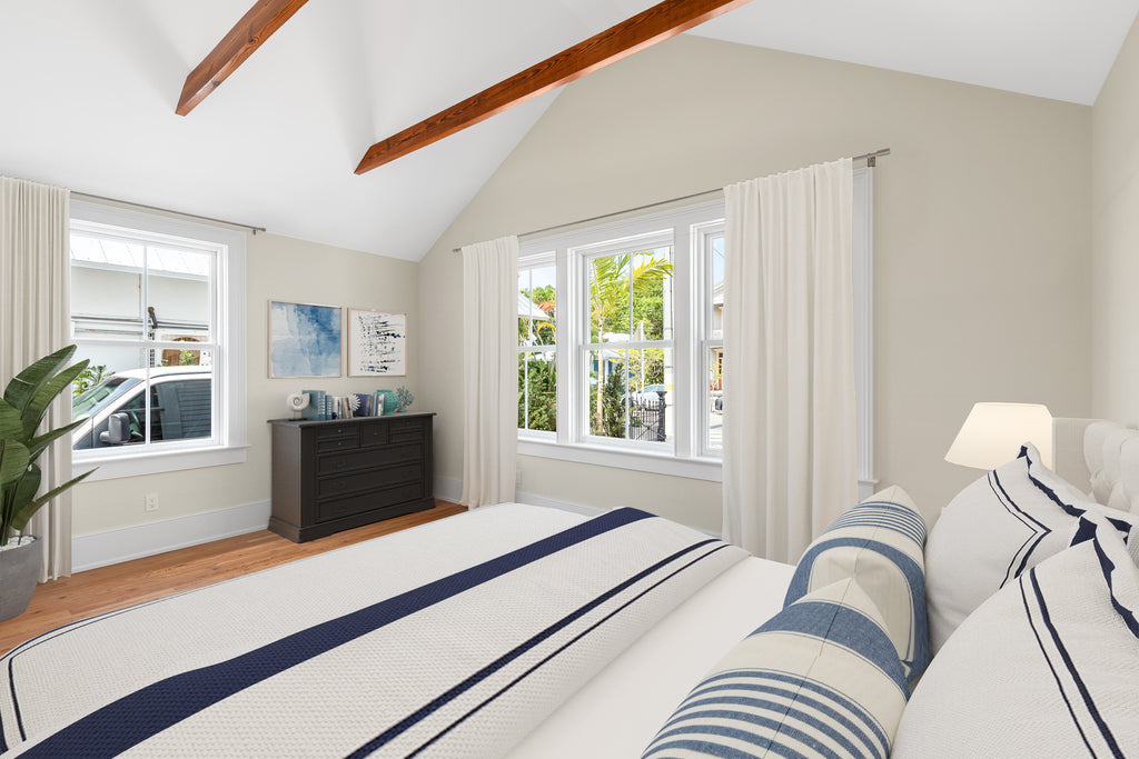 Virtual Staging in a bedroom with a coastal theme of blues and khaki colors