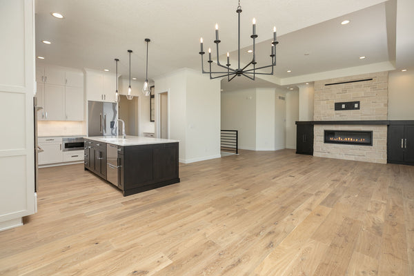 An unstaged new construction dining are and living room