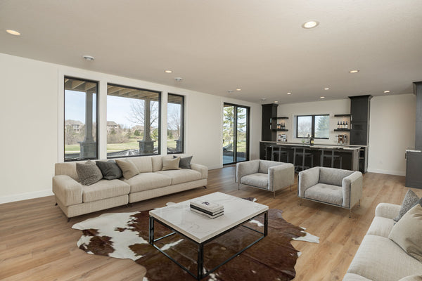 A virtually staged family room and bar area in a new construction home