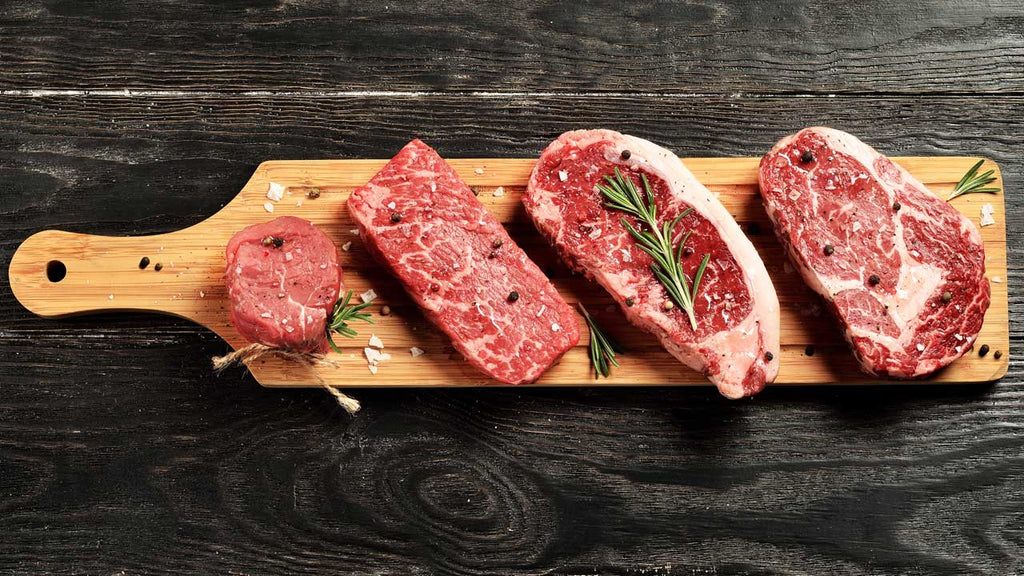 Raw Beef Cuts on a Cutting Board