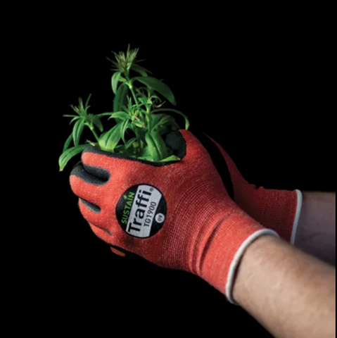 Traffi red carbon neutral work glove holding cut cannabis