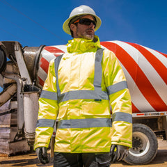 Worker on construction site wearing Portwest hi-viz jacket