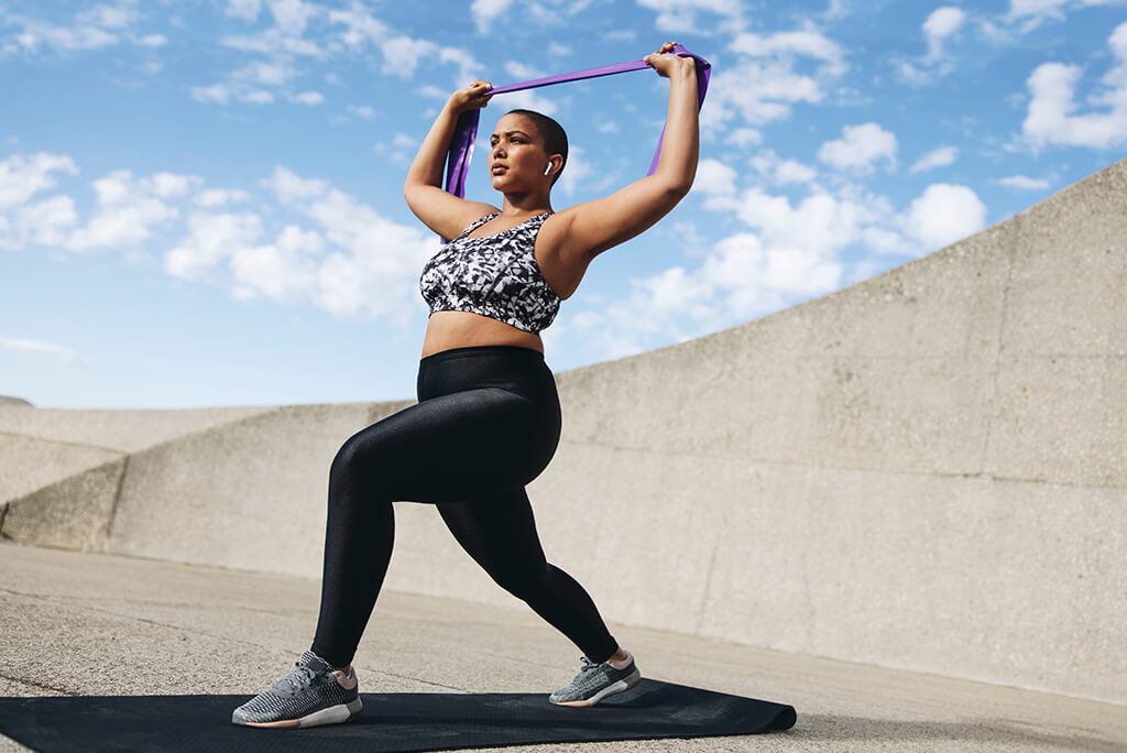 woman working out with bands