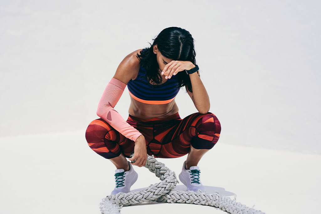 girl resting in between workouts