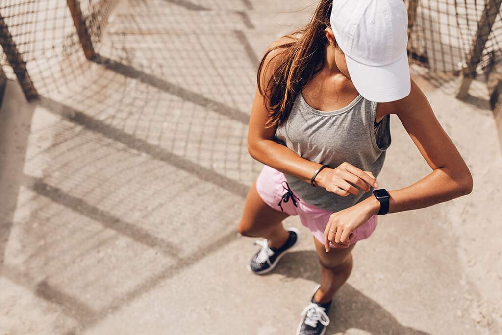 girl looking at her smartwatch