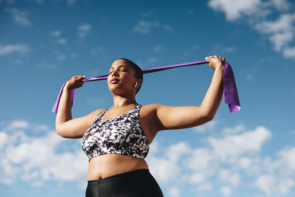 girl using bands for exercise