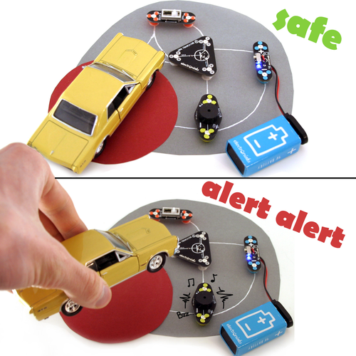 Circuit Scribe conductive silver ink circuit that activates an alarm when a toy car if picked up