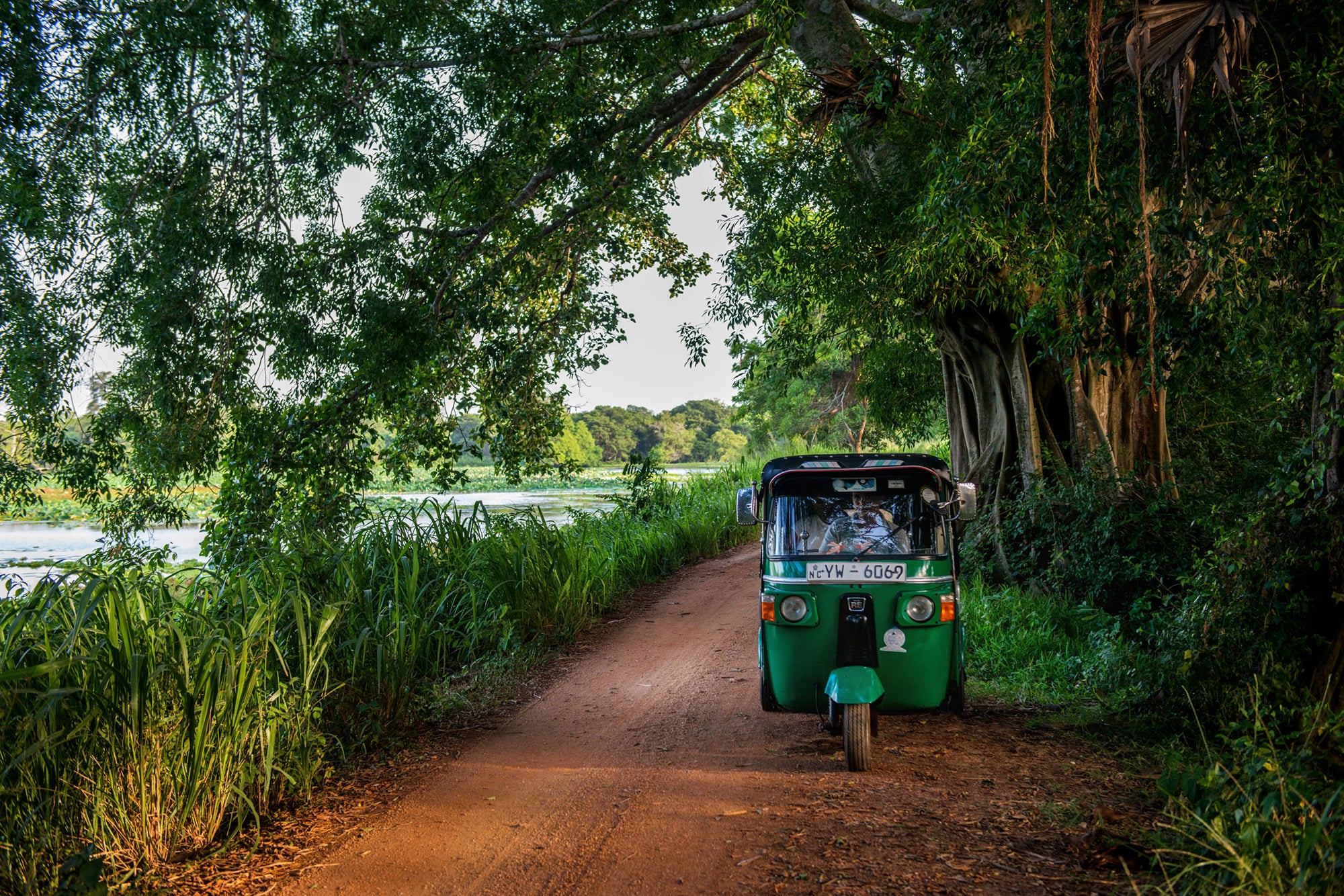 Meeting a tuk-tuk on a sandy lane Ulagalla