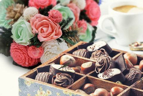 "Image: A stack of heart-shaped cookies , artifical flowers ideal for Valentine's Day .