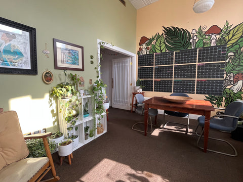 Jen’s office with rocker, plants and wall calendar