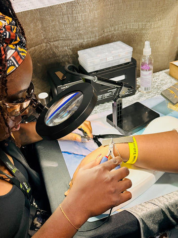 image of customer getting permanent jewelry