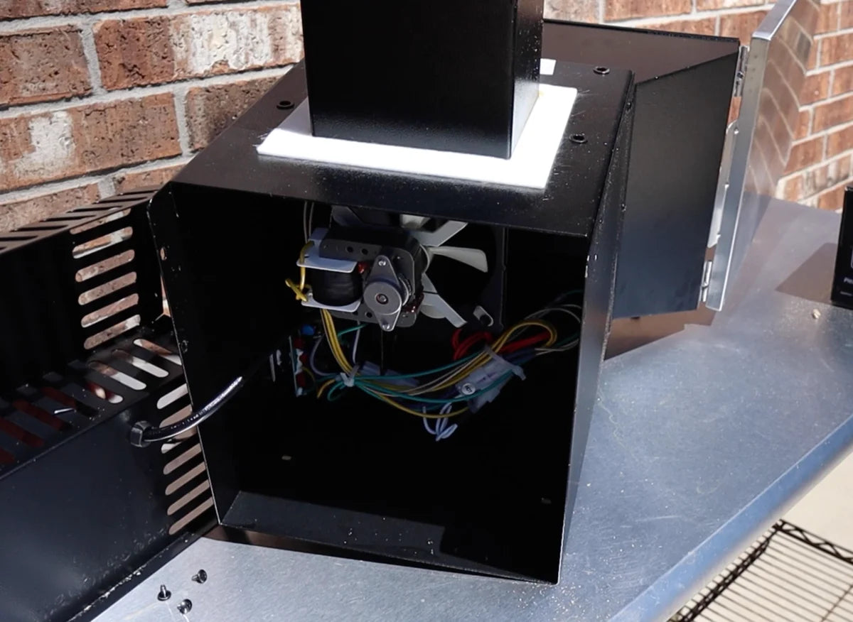 Hopper opened, exposing controller wires.