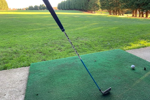 GForce 7 Iron Swing Trainer being used at golf driving range