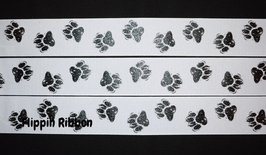 Paw prints in black printed on 7/8 white single face satin ribbon