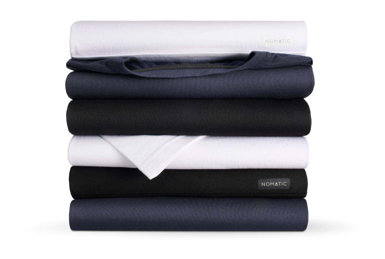 Stack-of-Outset-Shirts-White-Navy-Black.jpg__PID:3d0a16b9-a917-4998-af45-3db3d8566da1