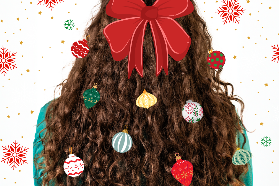 back of curly haired woman's head with multicolored ornaments in her hair with a red bow at the top