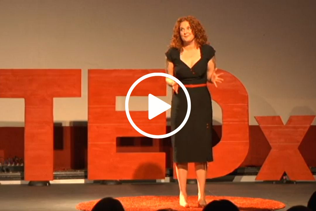 Jessicurl Founder Jessica McGuinty on stage, speaking at TEDx.