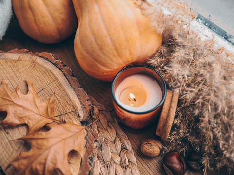 Fall candles and pumpkin decor in the greenhouse