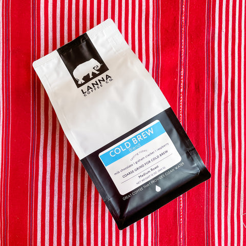 Lanna Coffee's Cold Brew blend resting on a colorful Thai tapestry