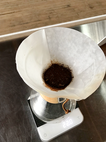 Chemex on scale with coffee grounds and filter