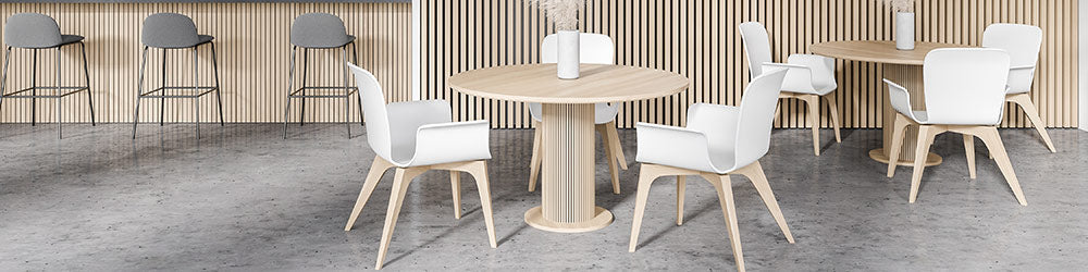 cafe furniture with white dining chairs, round table and barstools