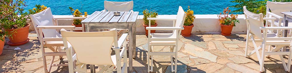 cafe furniture with rustic table,outdoor chairs and sea view