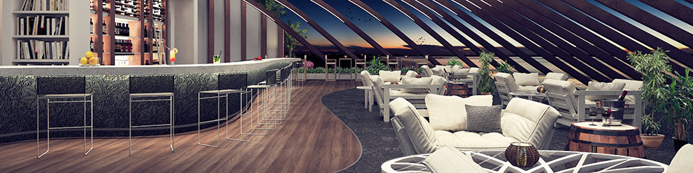 luxury barstools and bar table and there is a luxury outdoor furnitures right side of them