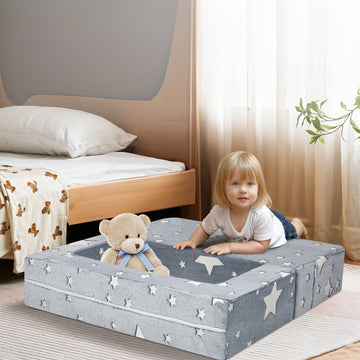 Little girl and her teddy bear playing on a mat composed of Convertible Sofa glow in the dark