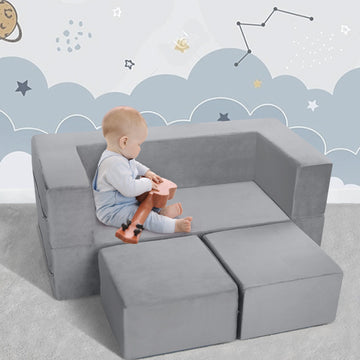 Little boy playing with toys on a sofa made up of Convertible Sofa solid colour