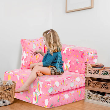 A child plays with a toy while sitting on a chair consisting of Kids Futon Sofa Bed glow in the dark