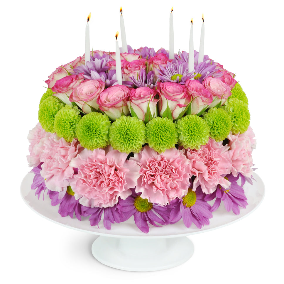 It’s Your Party!™. This ultimate party hit features spray roses, carnations, and more arranged to look like a birthday cake—real birthday candles included.