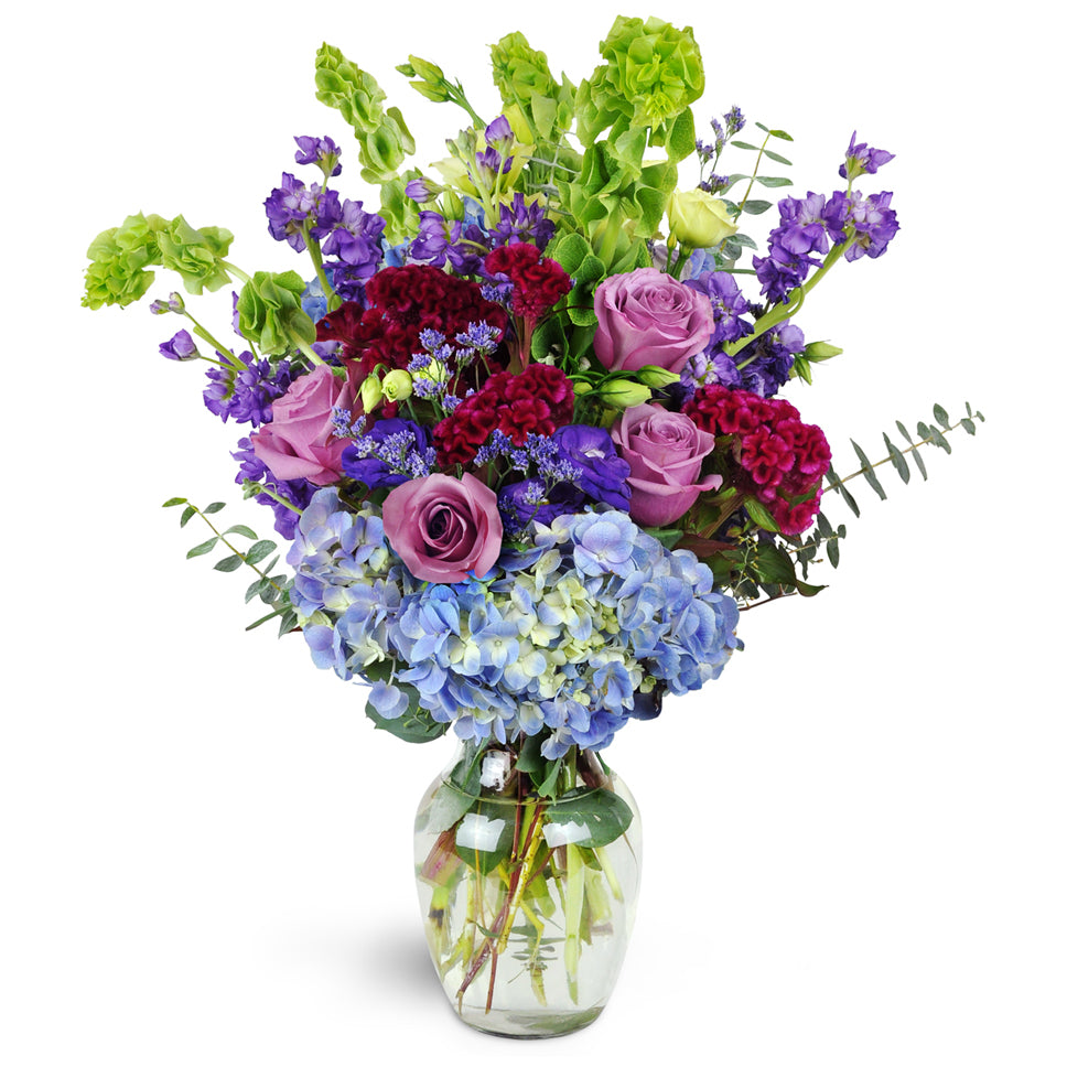 European Terrace™ - Deluxe. A lavish mix of roses, lisianthus, and hydrangea - this captivating arrangement is guaranteed to blow them away.