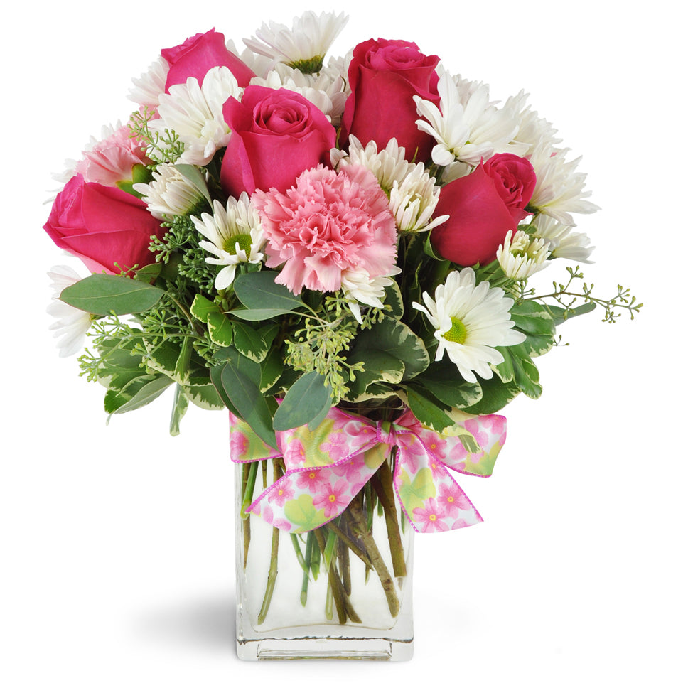 Lucky You!™. Roses, carnations, daisies, and more are cheerfully arranged in a modern glass vase.