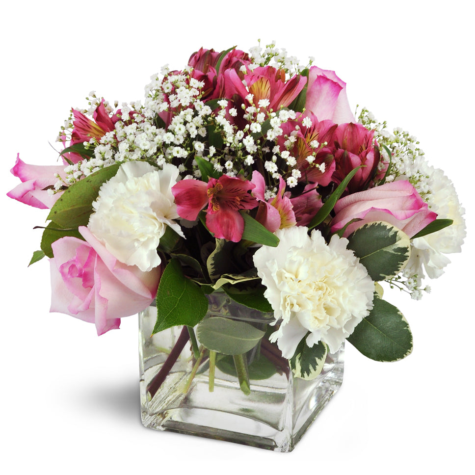Blushing Blessing Cube standard flower arrangement. Handcrafted with pink roses, pink Peruvian lilies, and white carnations.
