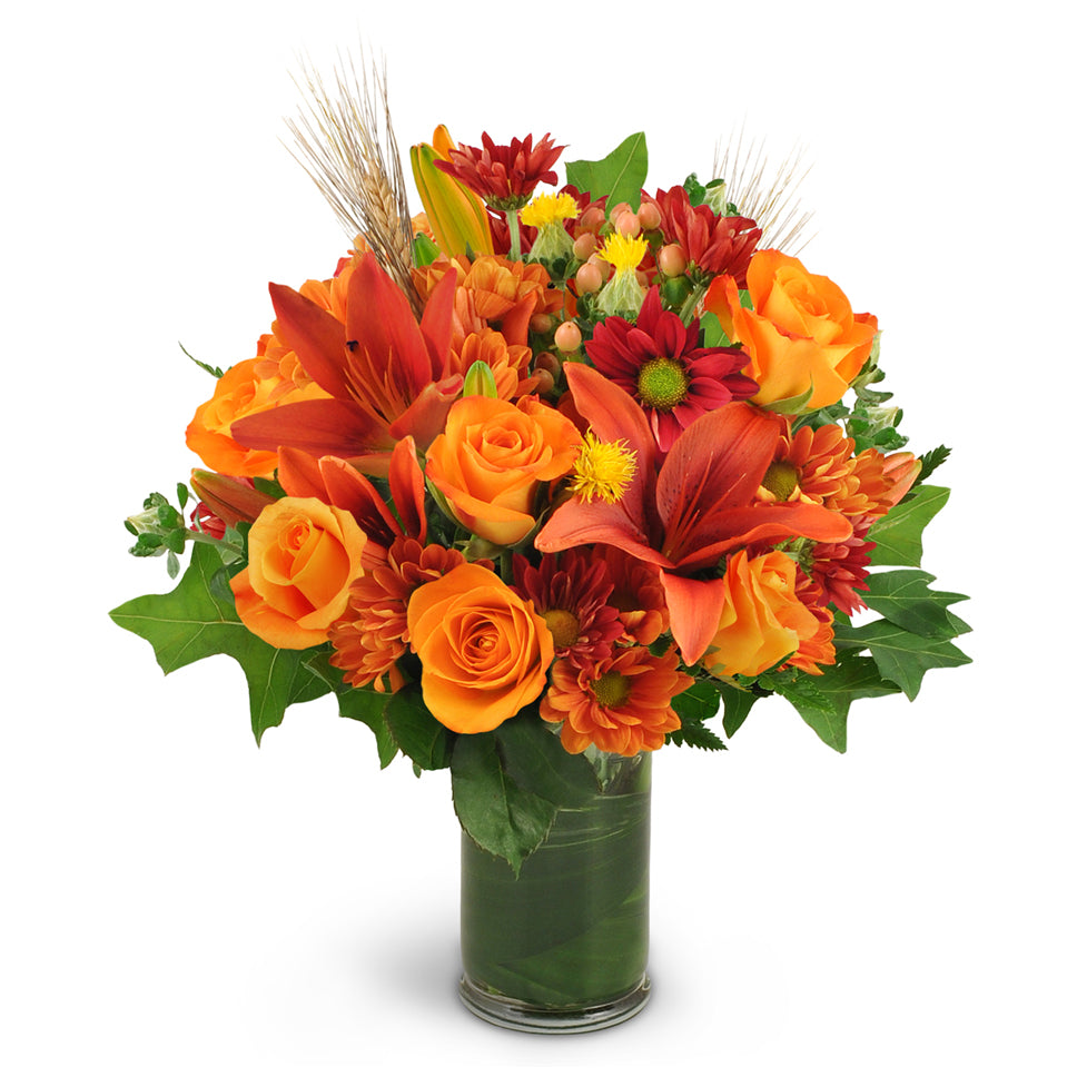 Autumn Awakening a premium flower arrangement - features orange lilies, roses, safflower, chrysanthemums, and hypericum berries—along with wheat, oak leaves, and aspidistra.