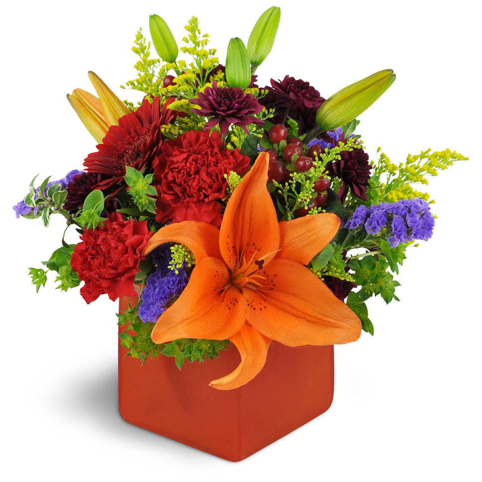 Fruit of the Bloom™ - Standard. A colorful mix of mini Gerbera daisies, Asiatic lilies, and chrysanthemums are accented with bupleurum, hypericum berries, purple statice, and orange waxflower.