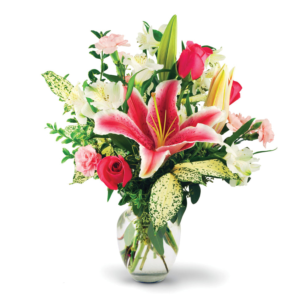 Blissful Pink. Stargazer lilies, roses, alstroemeria, and miniature carnations are accentuated with Florida beauty, seeded eucalyptus, and oregonia.