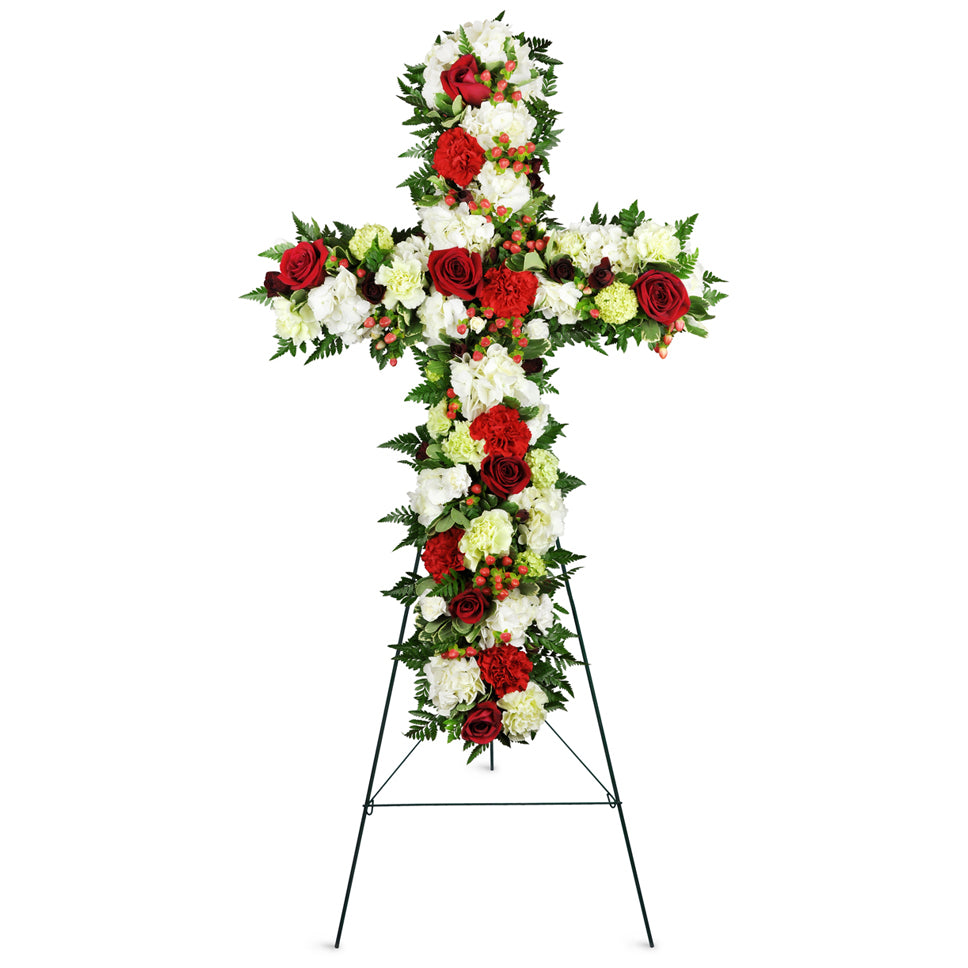Love and Prayers Sympathy Cross™. This classic standing spray cross features red and white carnations accented with fresh greenery.